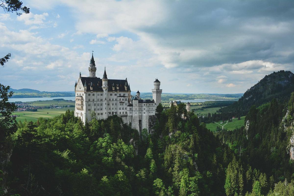 A castle on a hill under a wide sky.